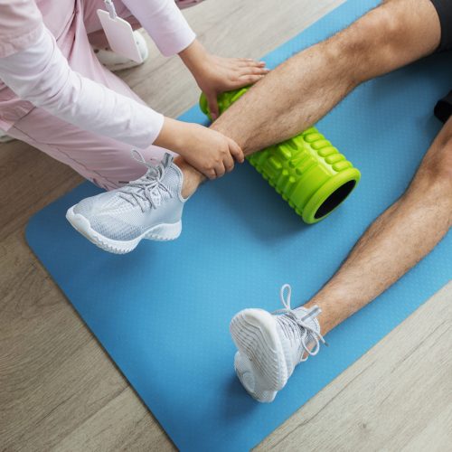 doctor-helping-patient-rehabilitation